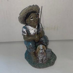 Vintage statue of a boy & his dog fishing